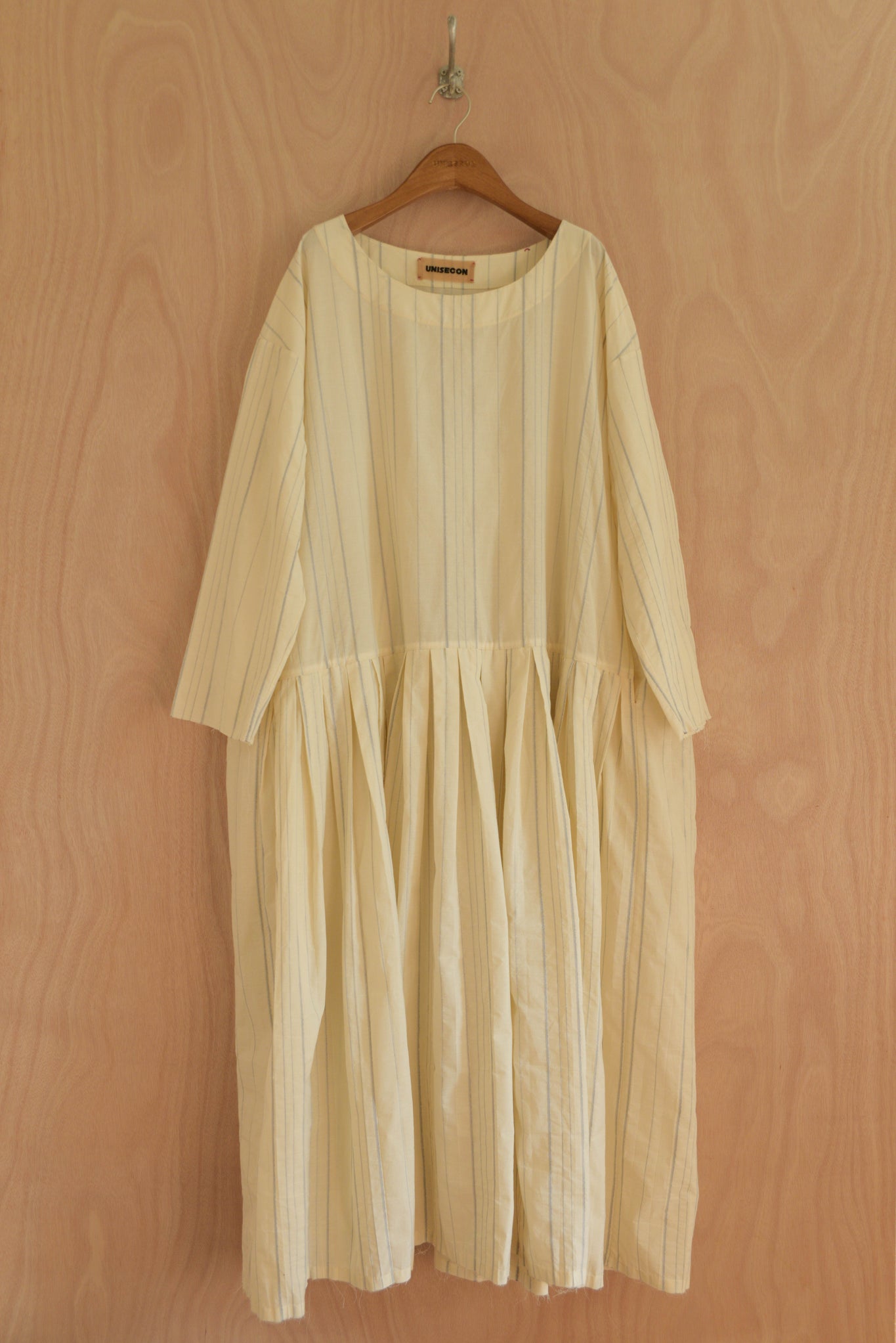Arya Dress front view in cream organic cotton with subtle blue-thread stripe