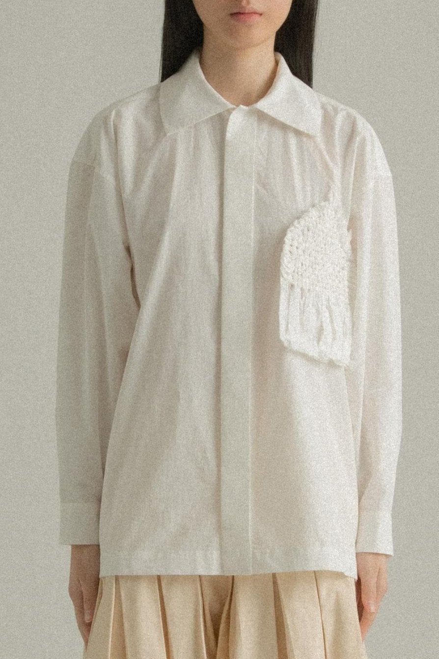 white charlotte top with a hand-woven chest panel