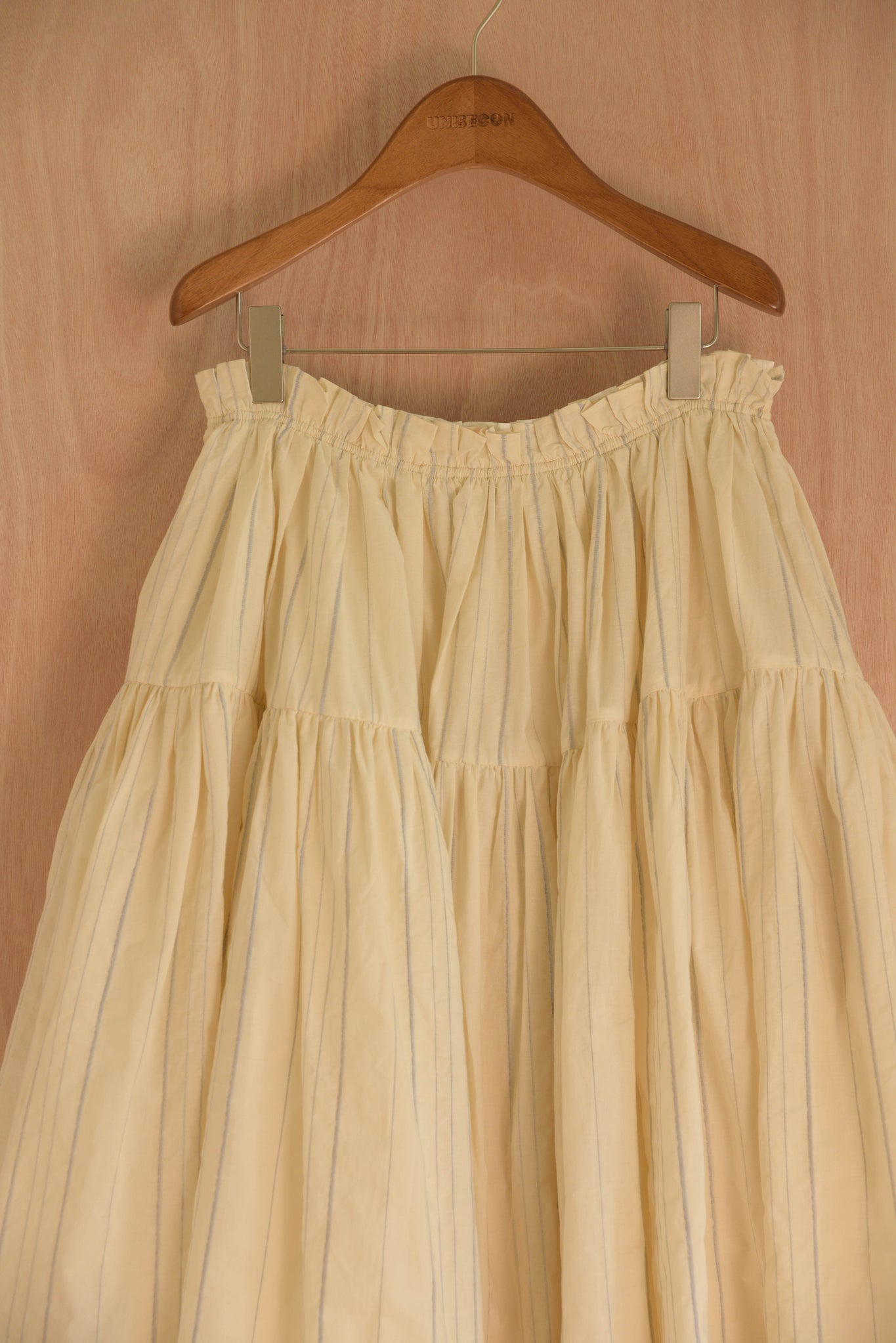 Close-up of hand-finished elastic waist and airy cotton texture