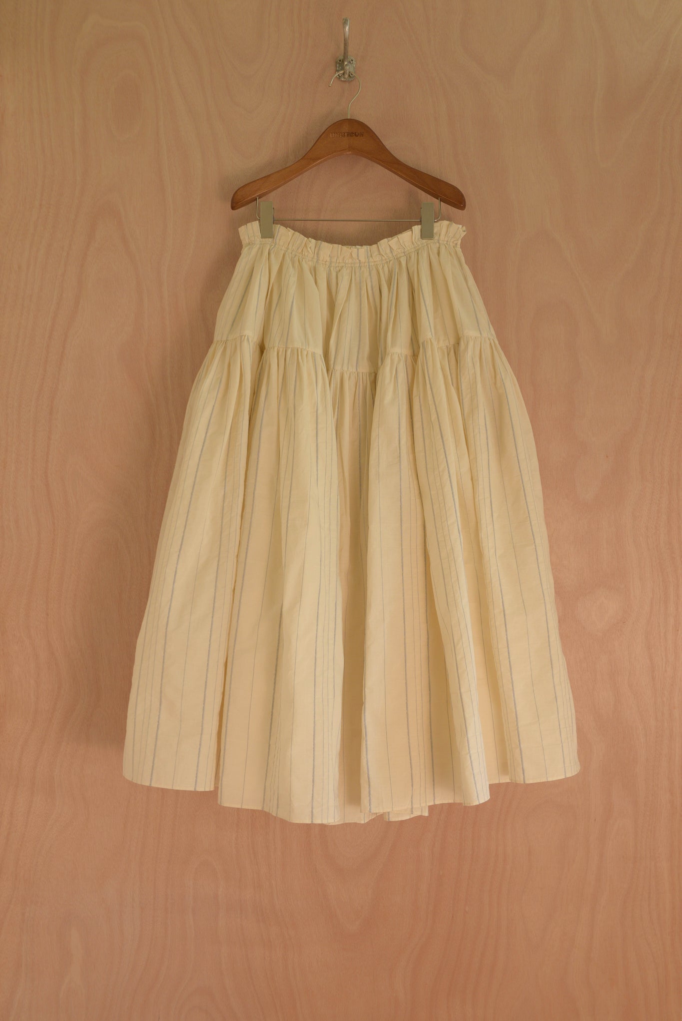 Maud Skirt front view in cream organic cotton with softly gathered pleats