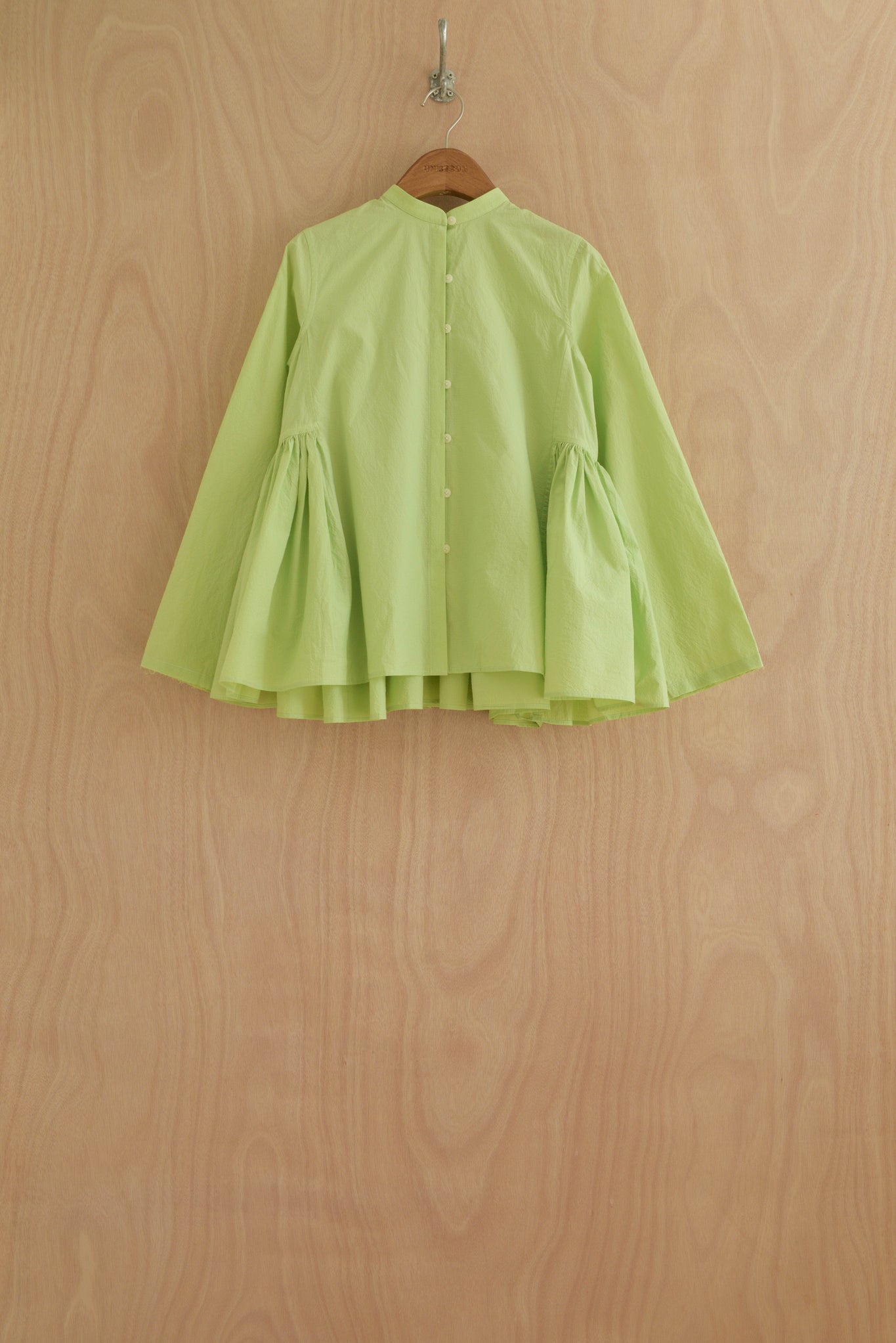 Myra Top front view in light green Chinese organic cotton with voluminous sleeves