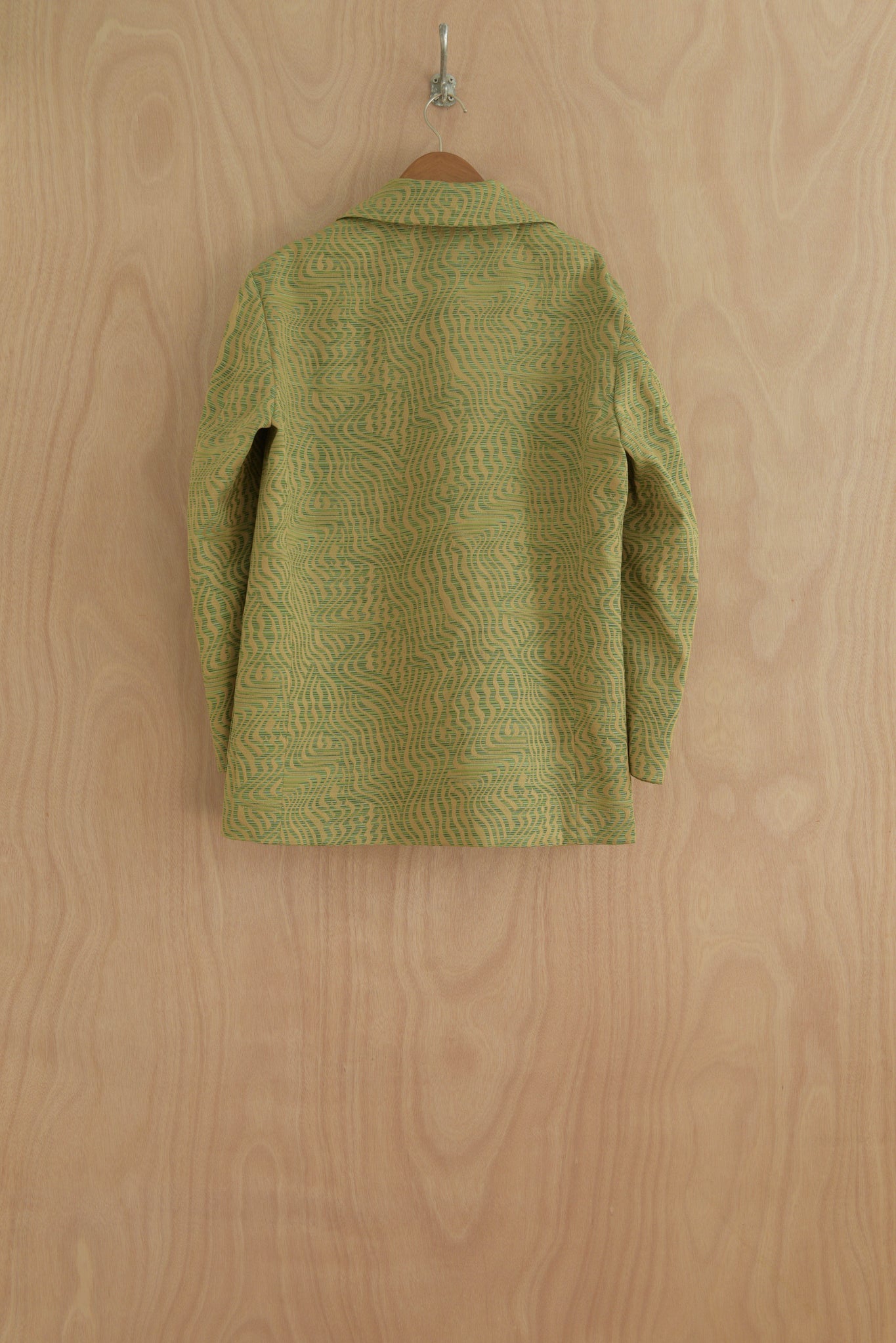Back view of Nicole Jacket in Green, structured silhouette