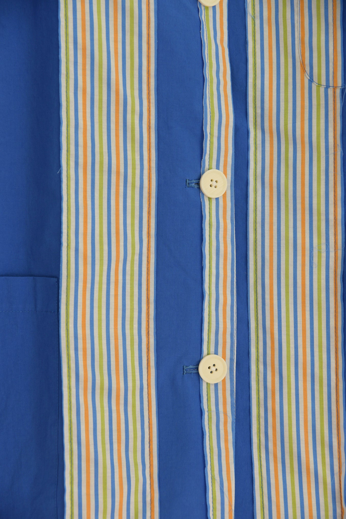 Close-up of blue striped organic cotton fabric on Nicole Jacket