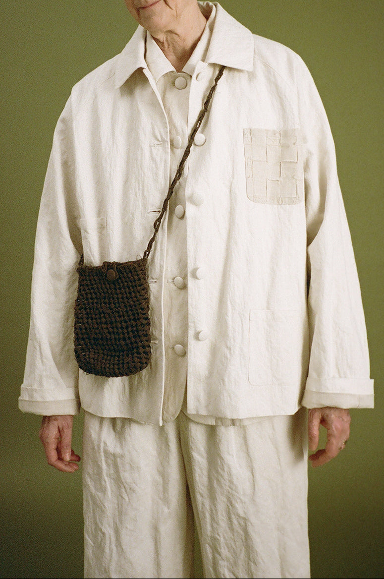 white jacket showing a handwoven chest pocket