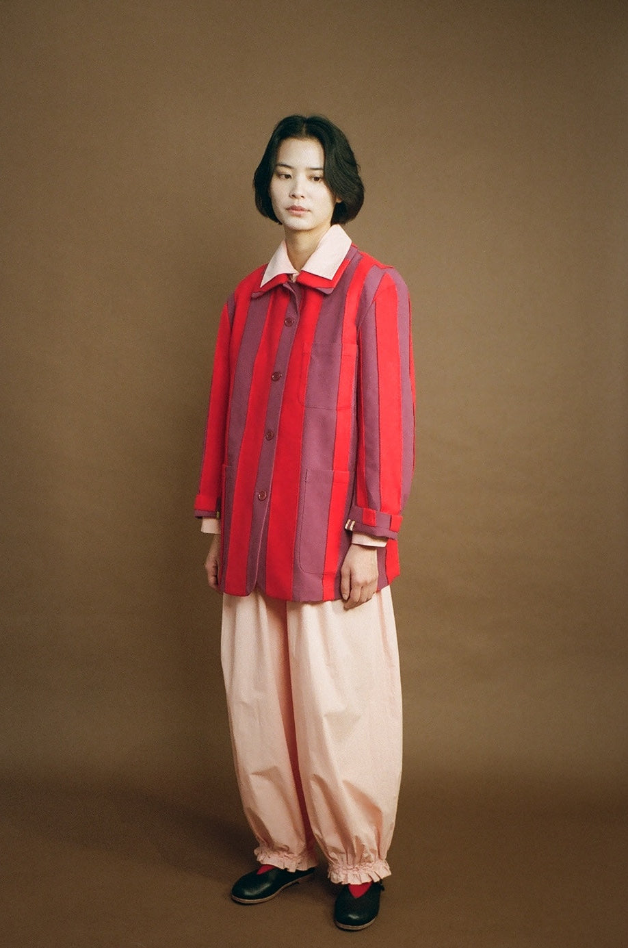 Model front view wearing the red Nicole Jacket