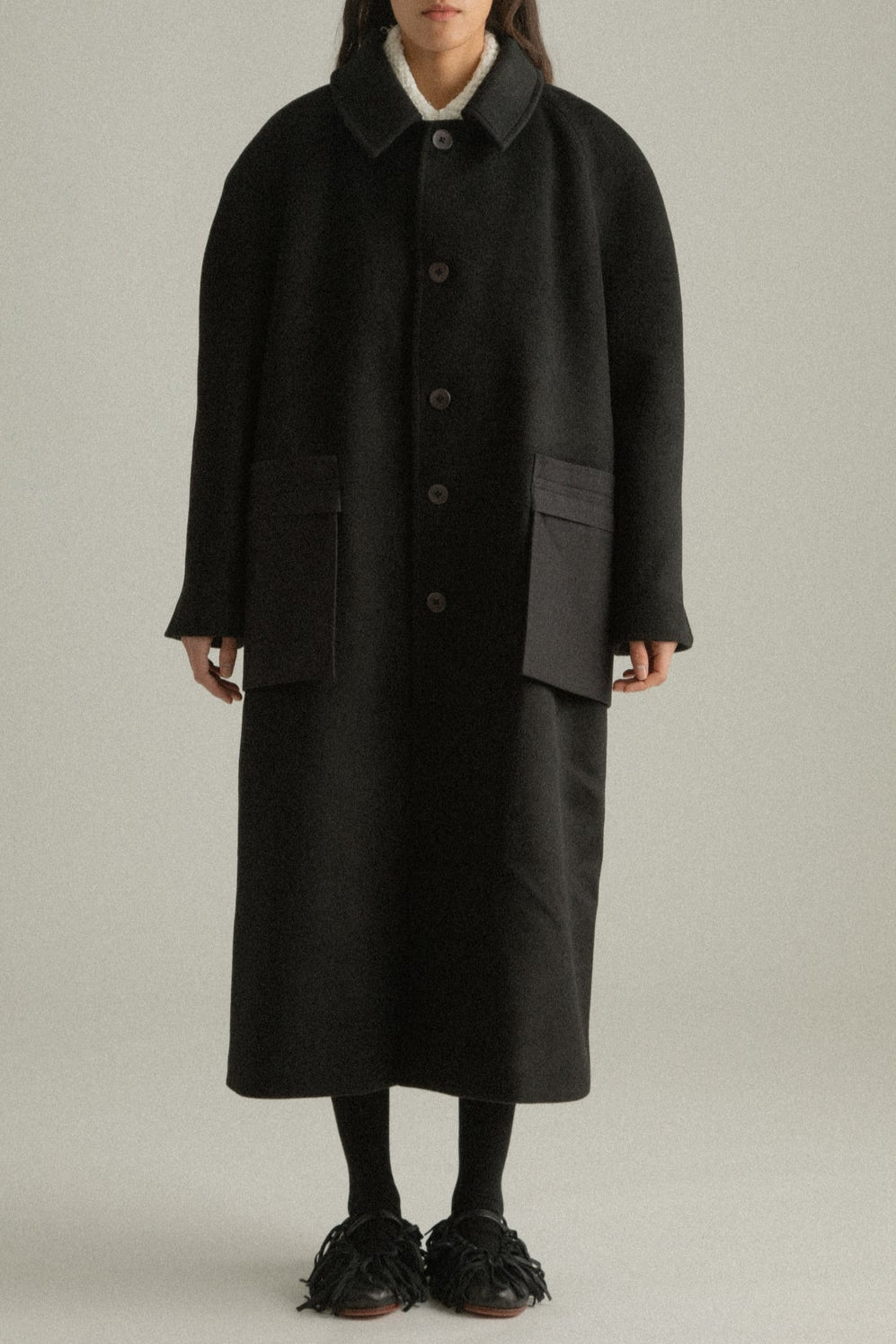 Alma Coat cropped front view highlighting the notched collar and clean lines of its relaxed fit.