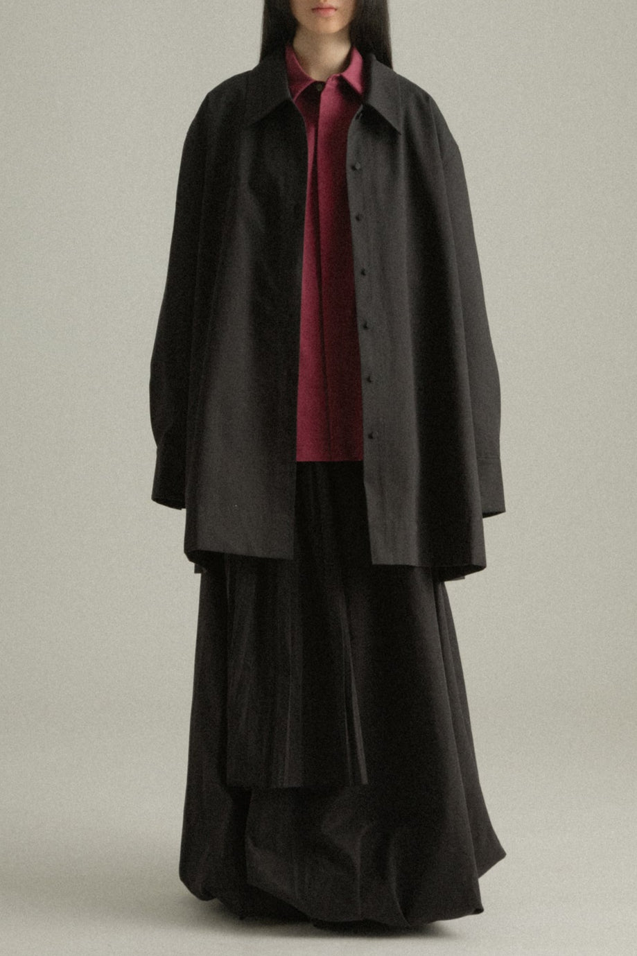 Cropped front view of Assia Jacket, focusing on the spread collar and button detail.