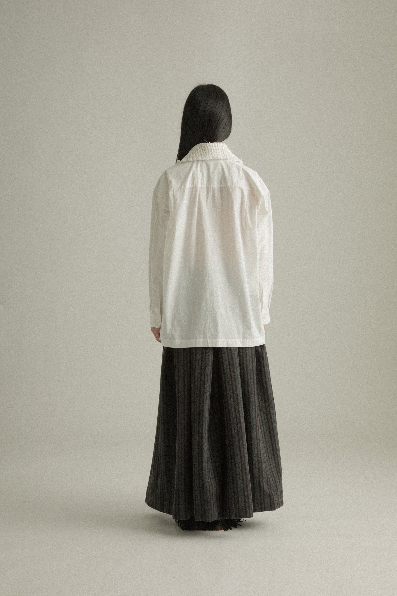 Back view of Ava Shirt in white organic cotton poplin, emphasizing the handcrafted collar design from the rear.