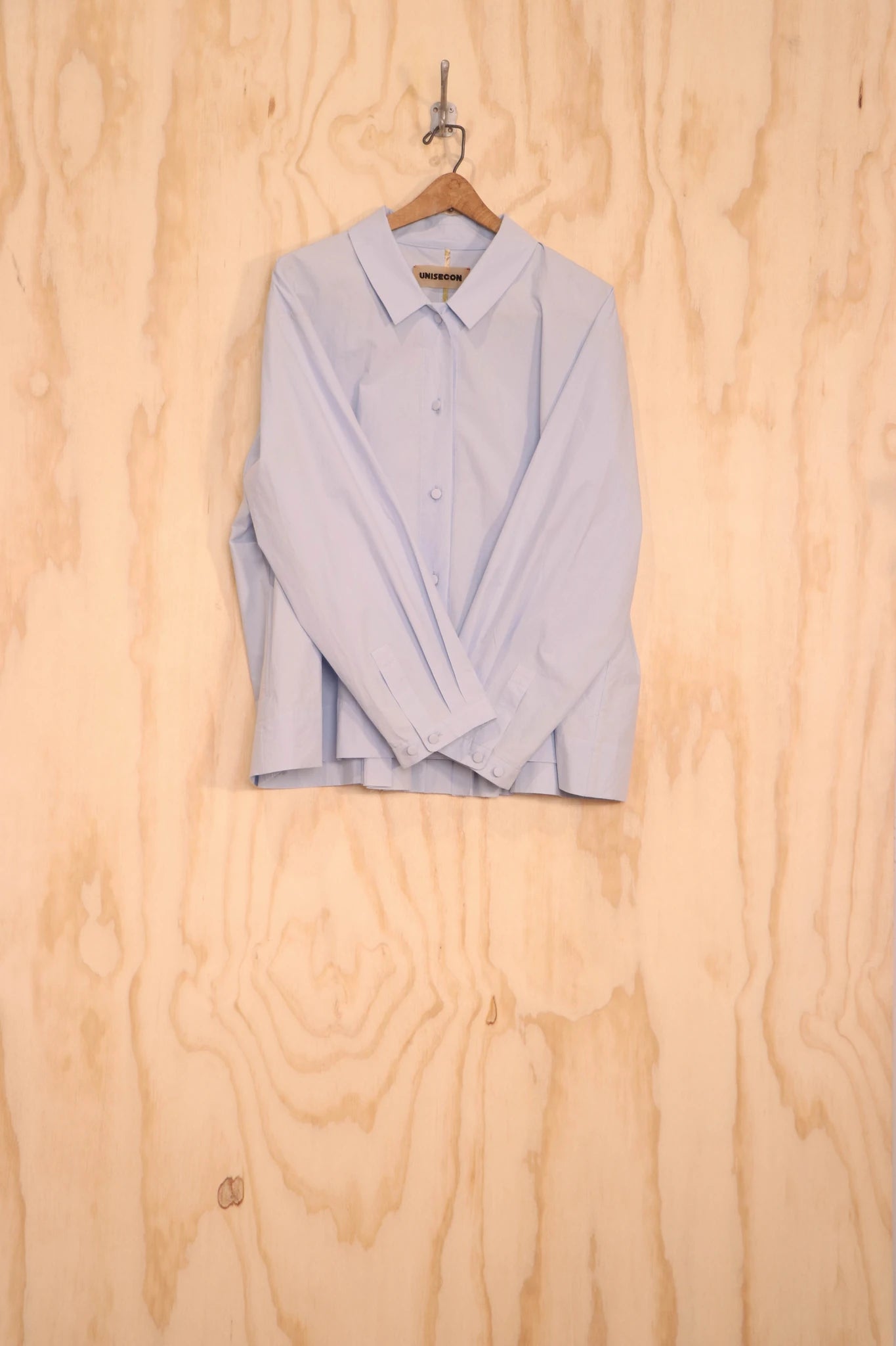 Bea Top clean collar and button front detail.