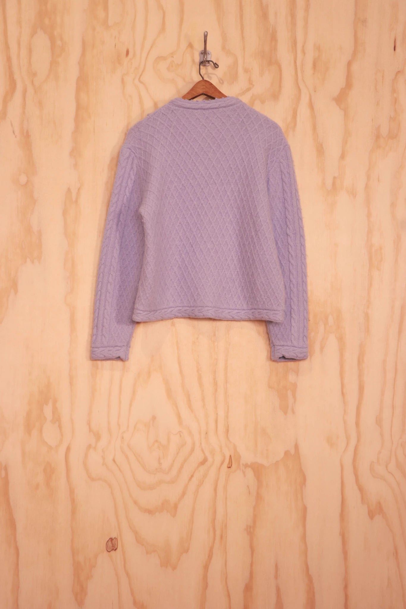 Back view of Frida Sweater showing cropped length and rib hem