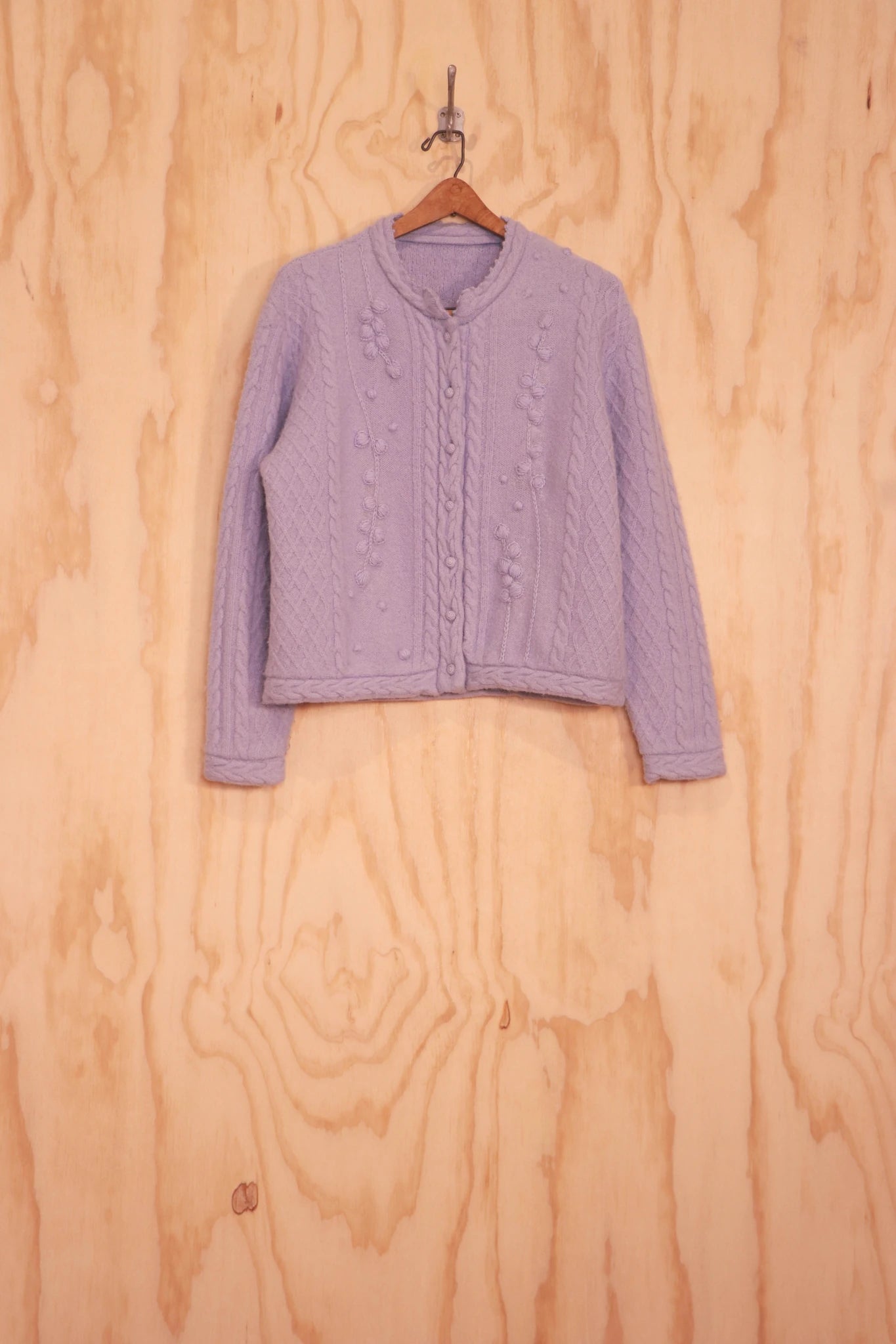 Front view of Frida Sweater in purple royal alpaca with cable and hand-embroidered lines