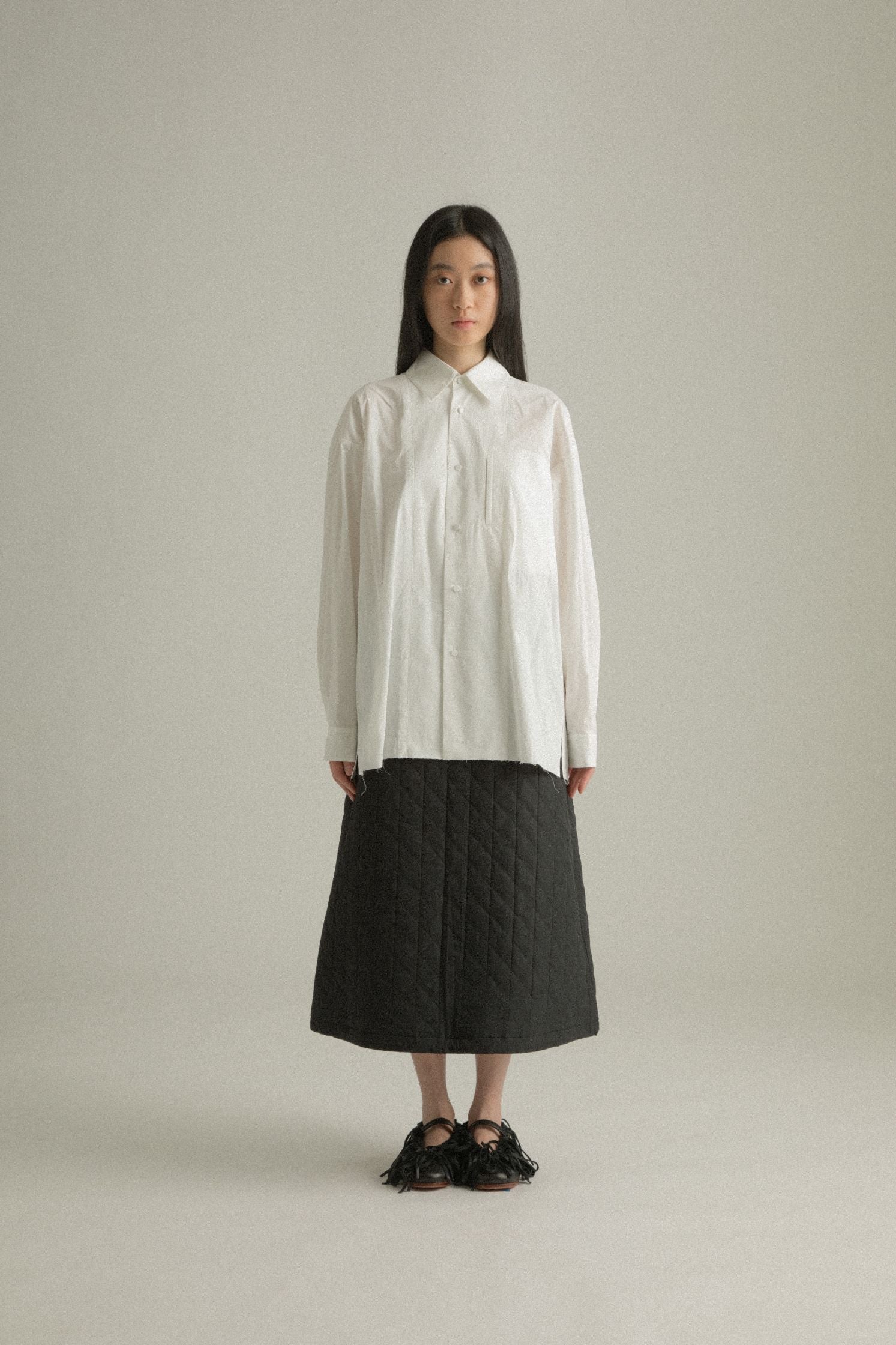 Front view of the Harvey Shirt in white organic cotton, showcasing its minimalist H-line silhouette and soft drape.