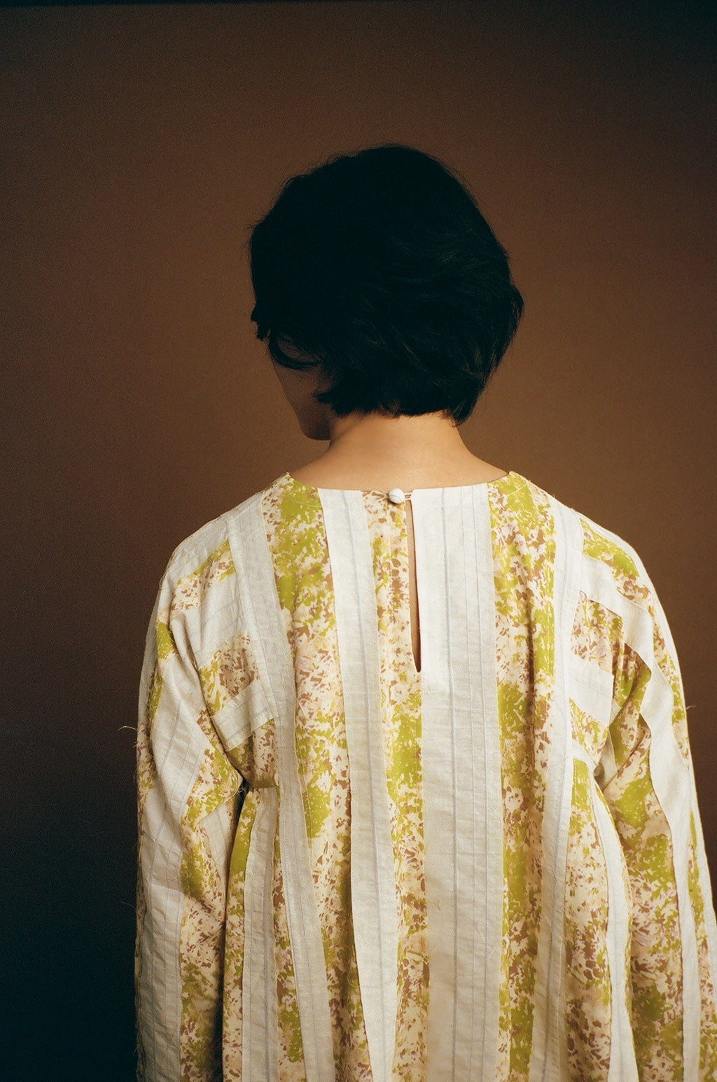 On-body back view highlighting panel placement.