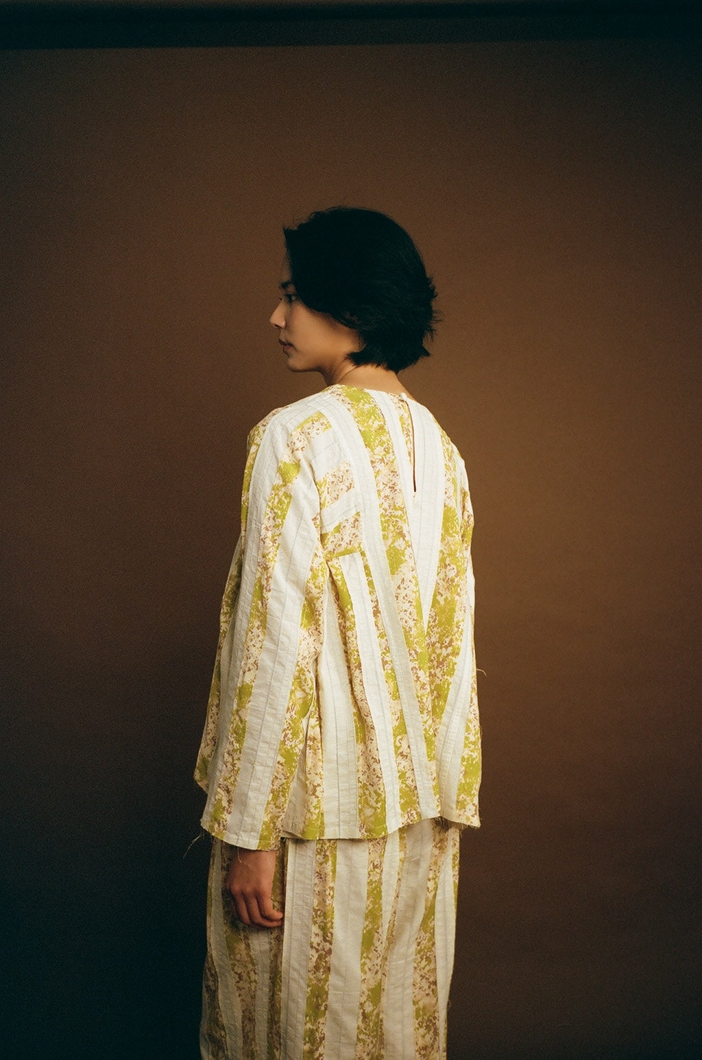 On-body front view showing boxy fit and crew neck.