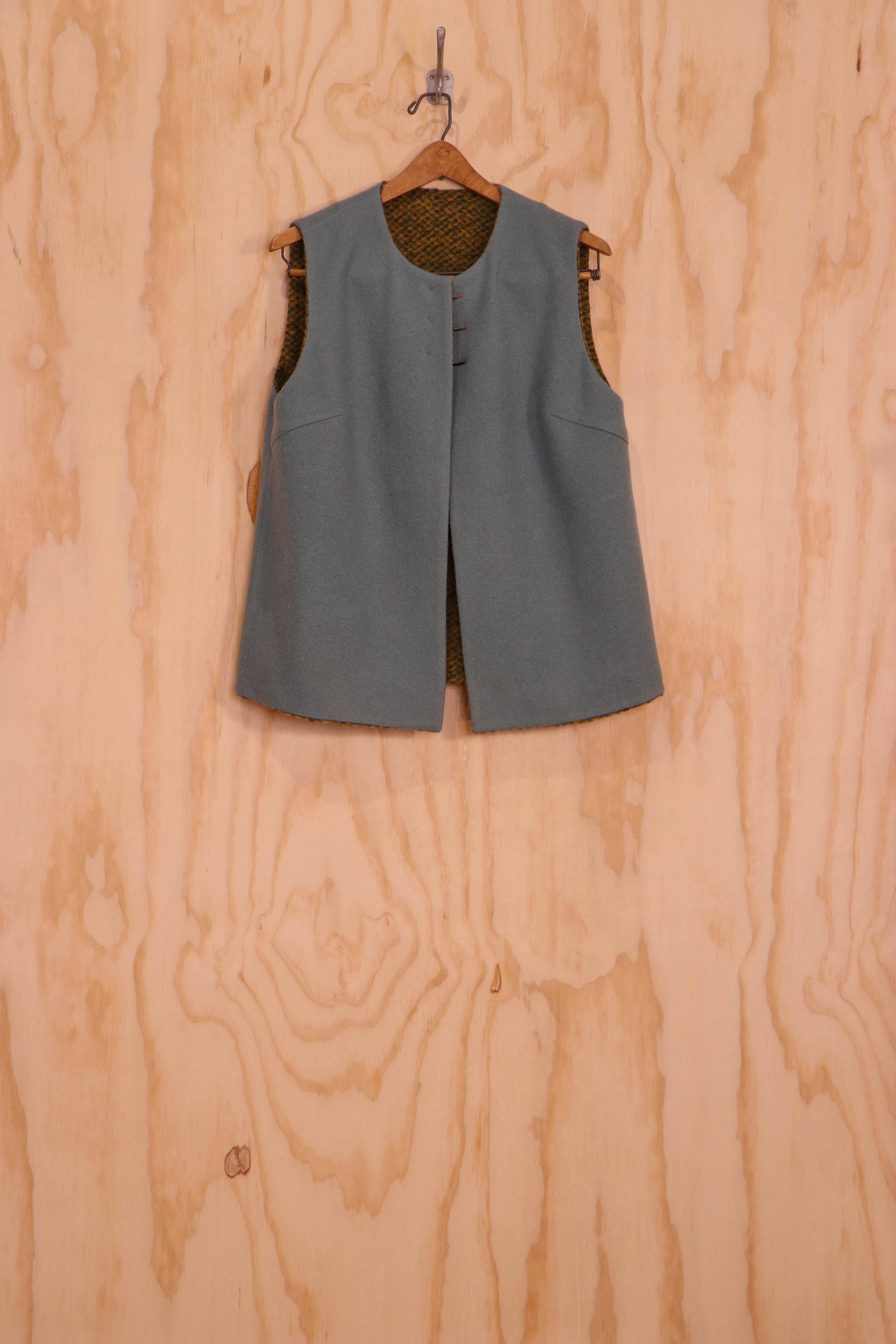 Inside view of Mira Vest on grey reversible side, three-button closure