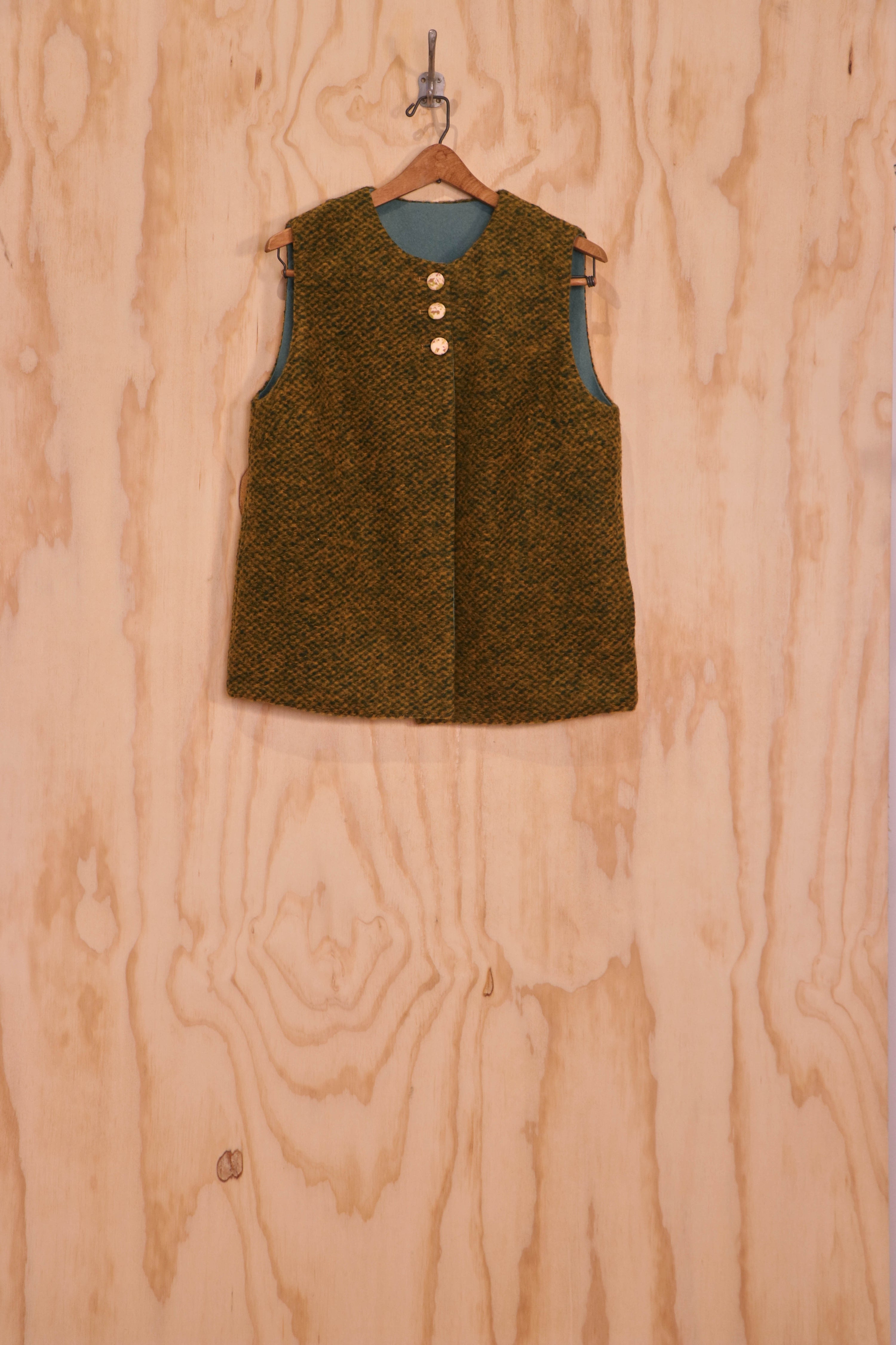 Front view of Mira Vest in olive loop-pile mohair, three-button closure