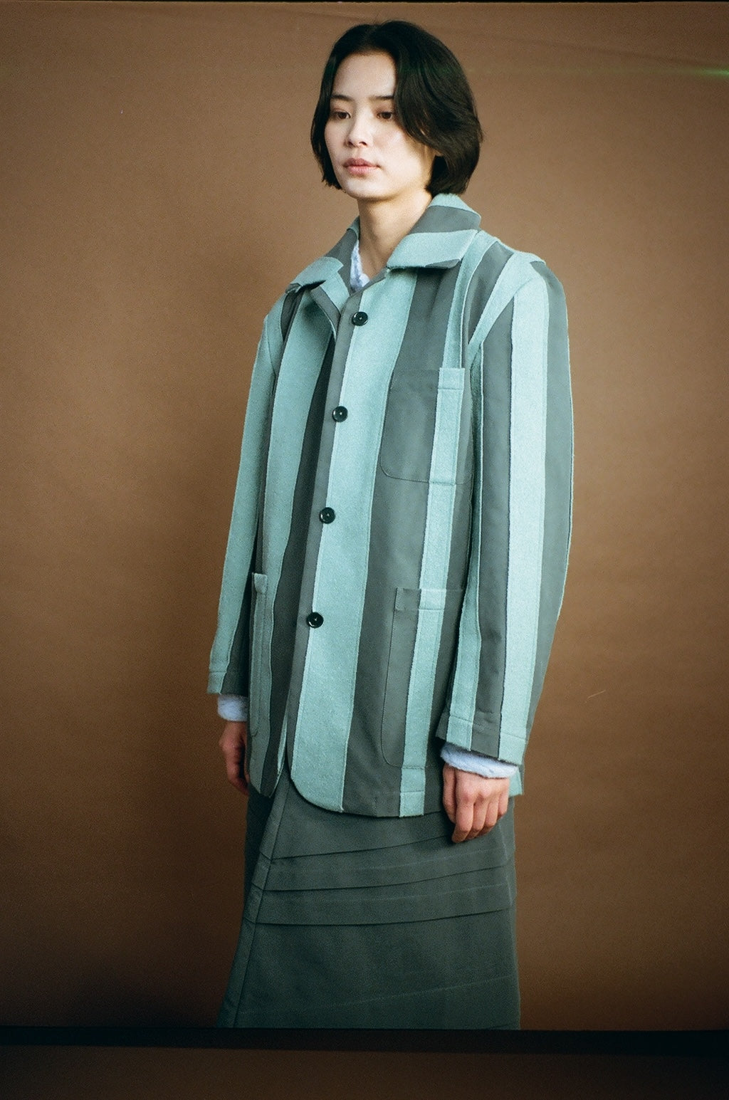 Nicole Jacket in sage–charcoal stripe on model, front view