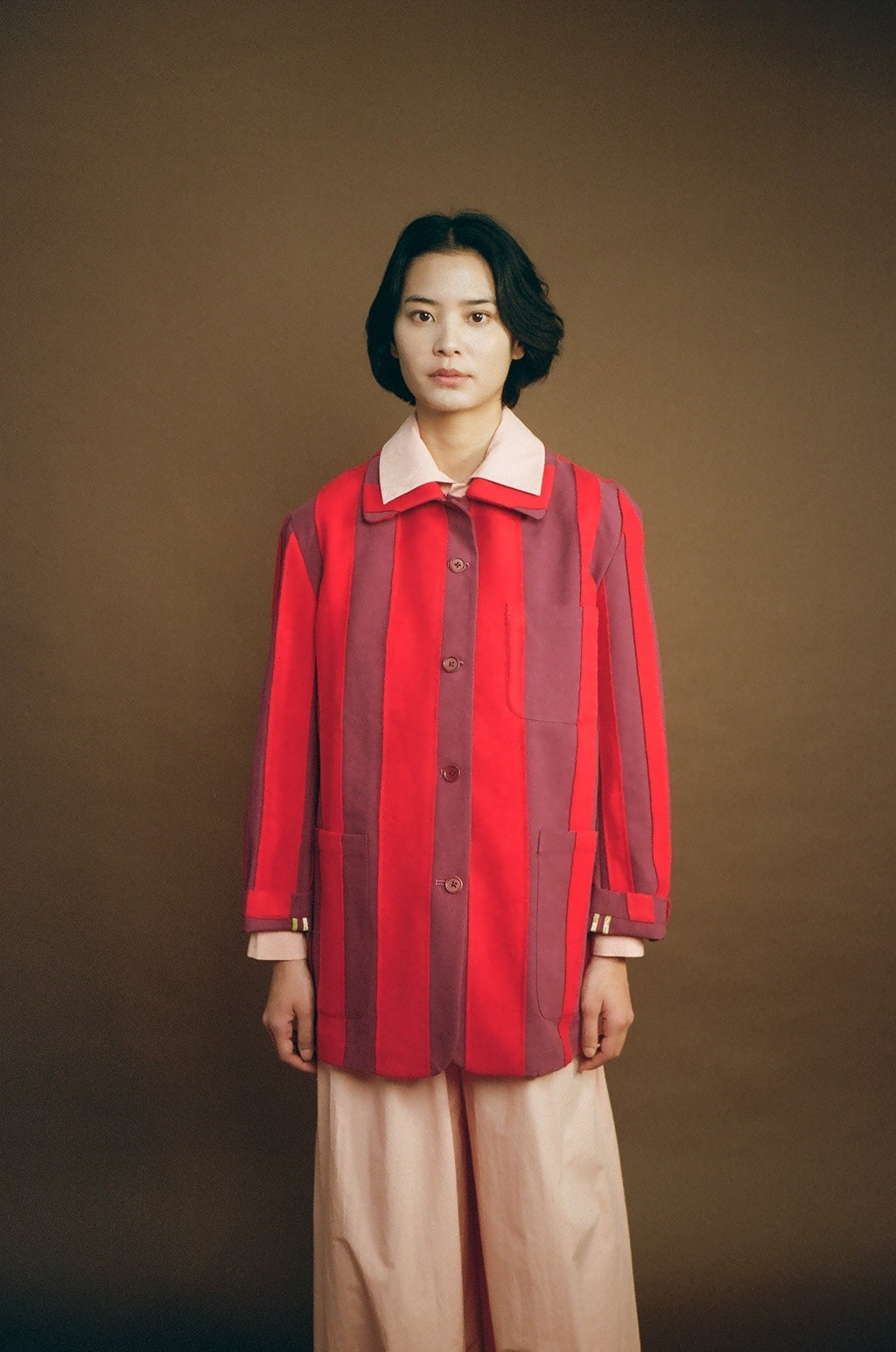 Model front view wearing the red Nicole Jacket