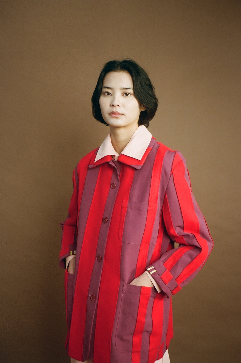 Model front view wearing the red Nicole Jacket