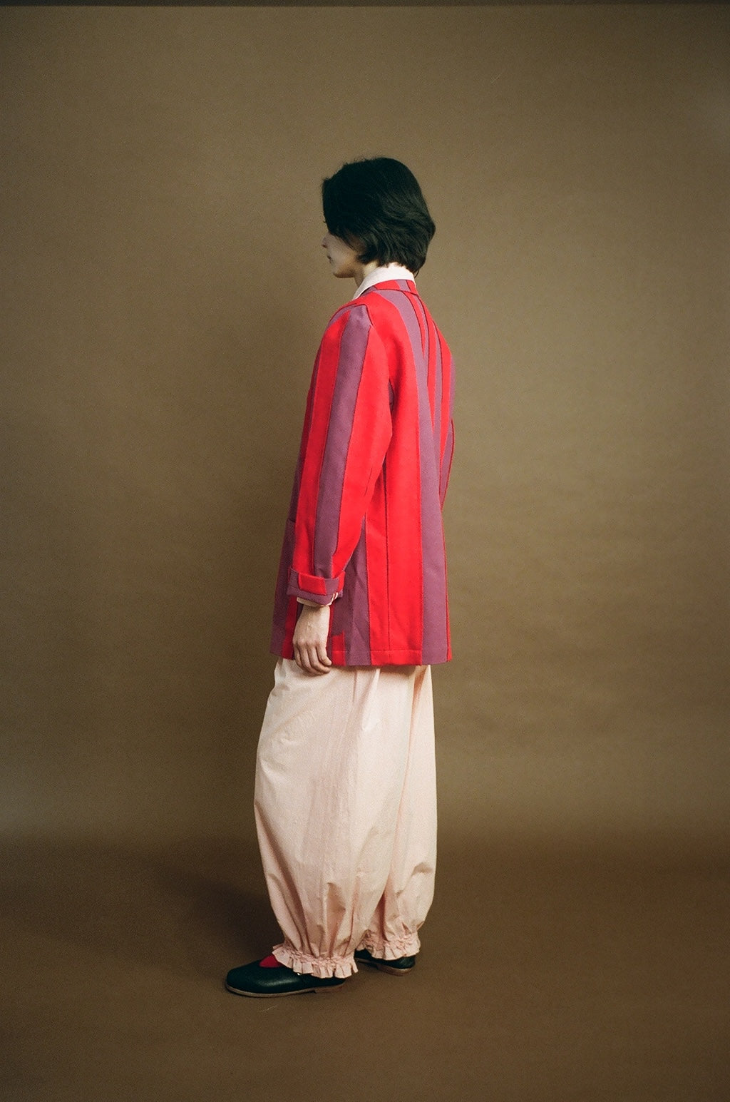 Model side view showing collar and stripe panels