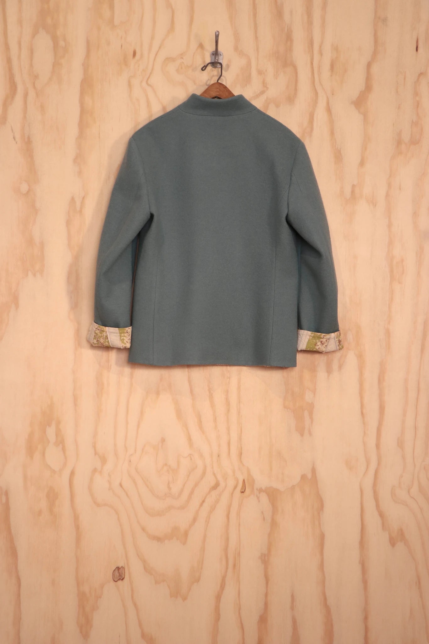 Back view of Patcha Jacket in sage wool–cotton