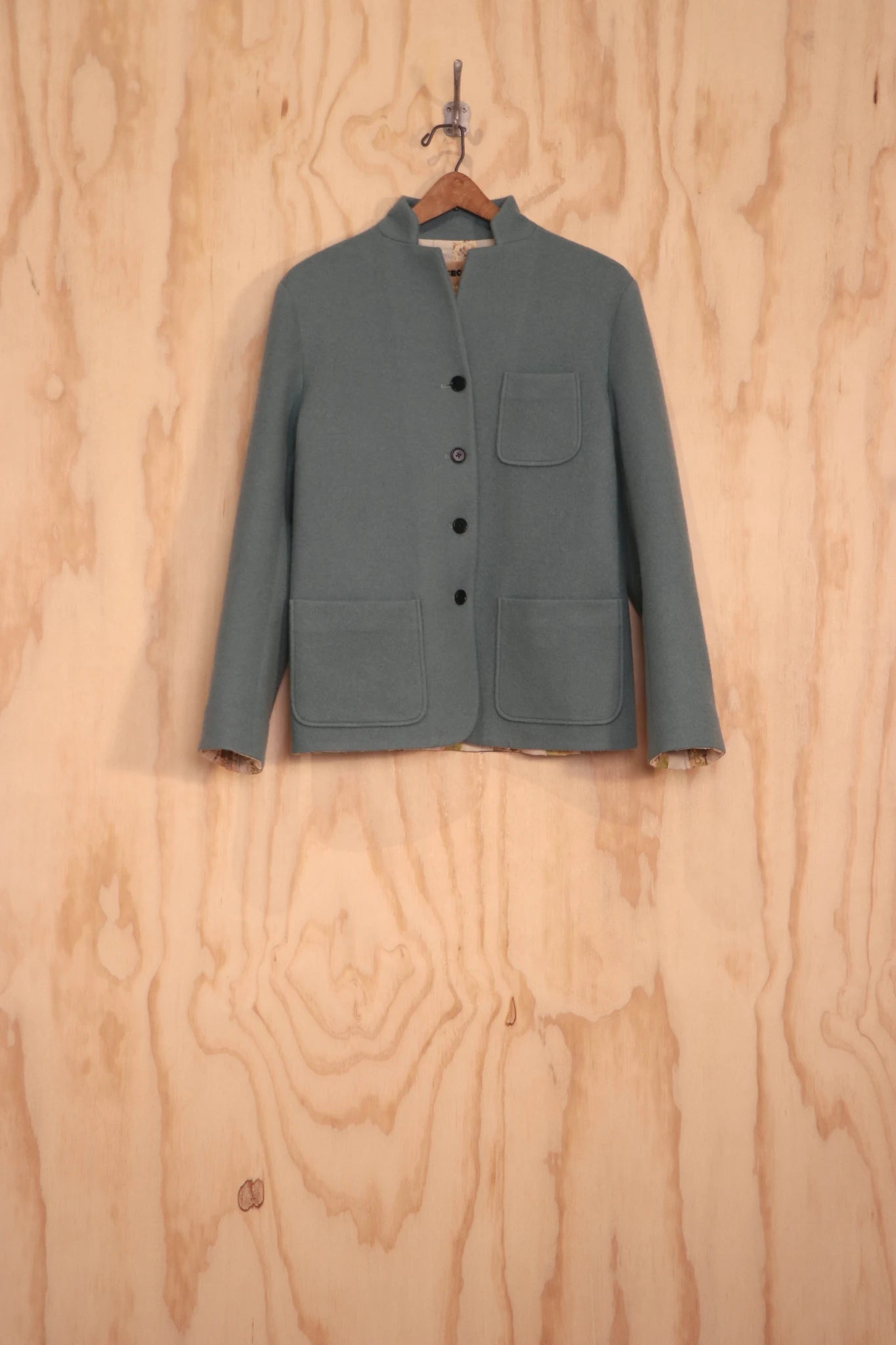 Front view of reversible Patcha Jacket in sage wool–cotton
