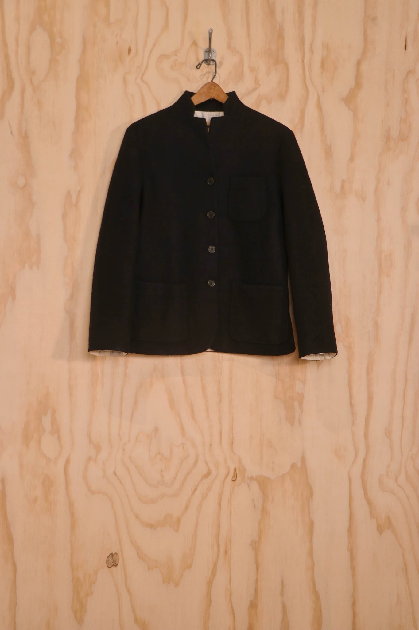 Close-up of stand collar and button placket on the Patcha Jacket