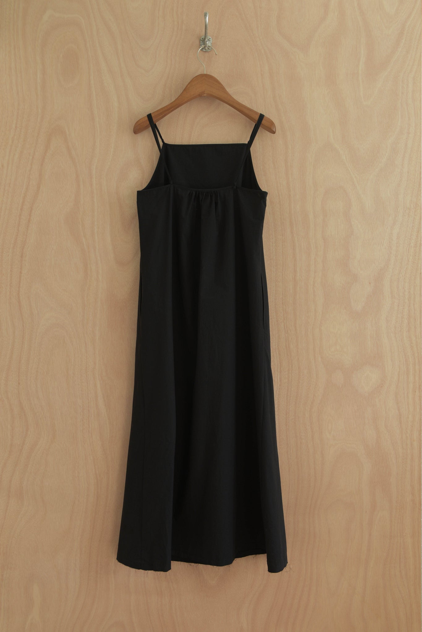 Back of Paula Dress showing smooth drape and shoulder strap detail