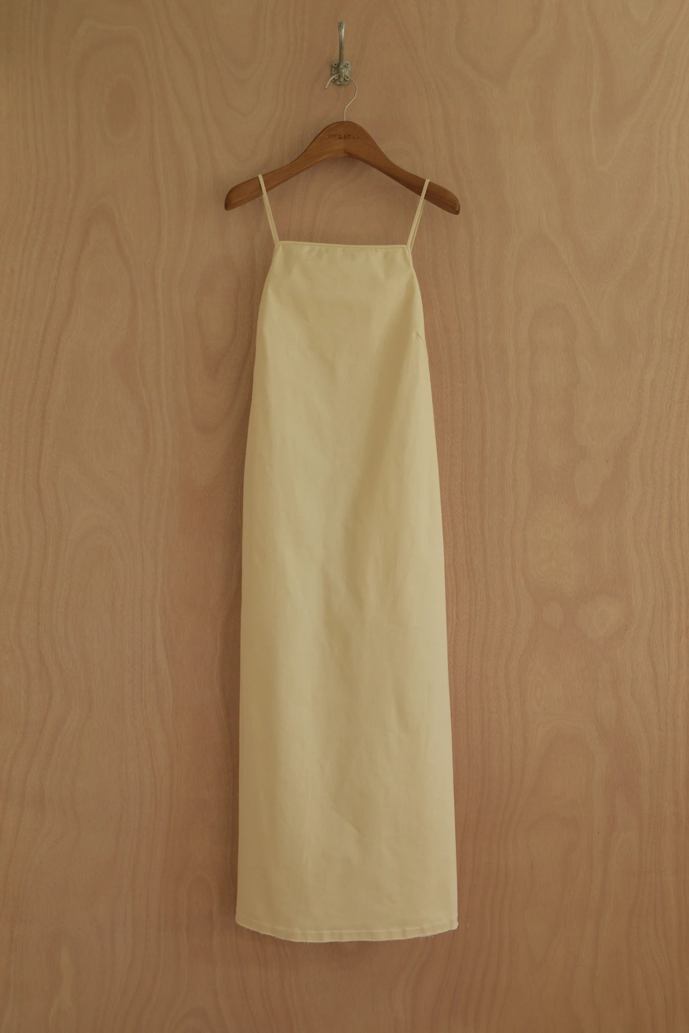Front view of Paula Dress in butter yellow organic cotton with narrow straps