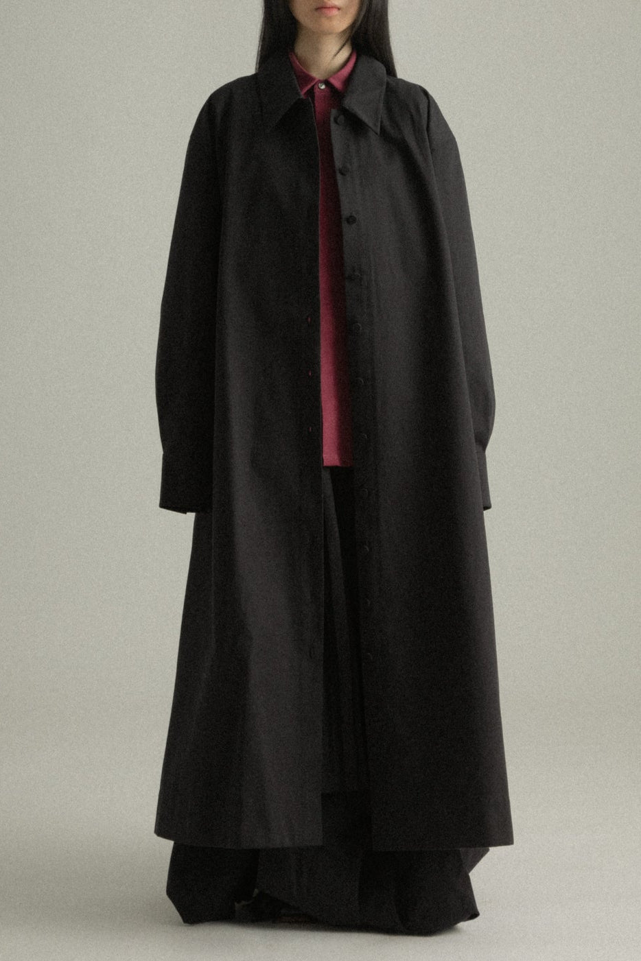 Cropped front view of Romy Coat, highlighting the banded collar and button-front closure.