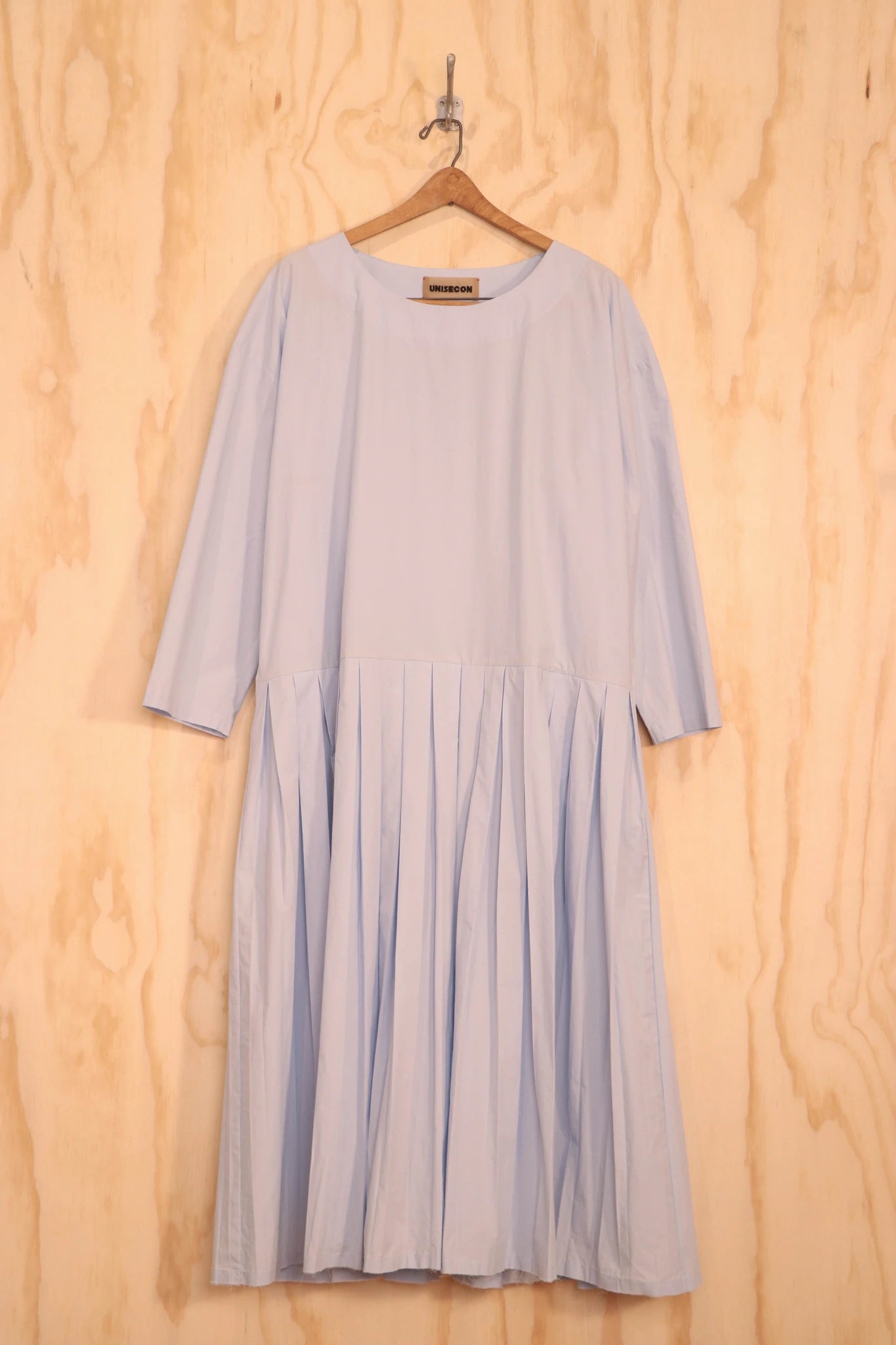 Front view of Arya Dress in light blue organic cotton with asymmetric gathers