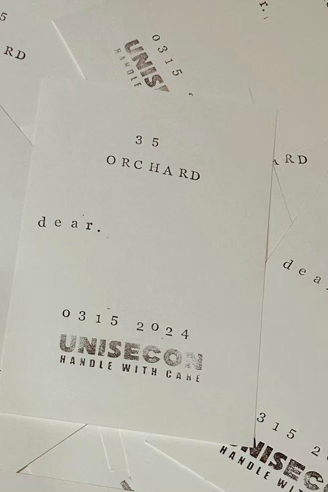 Stack of envelopes with 'Unisecor' branding and text