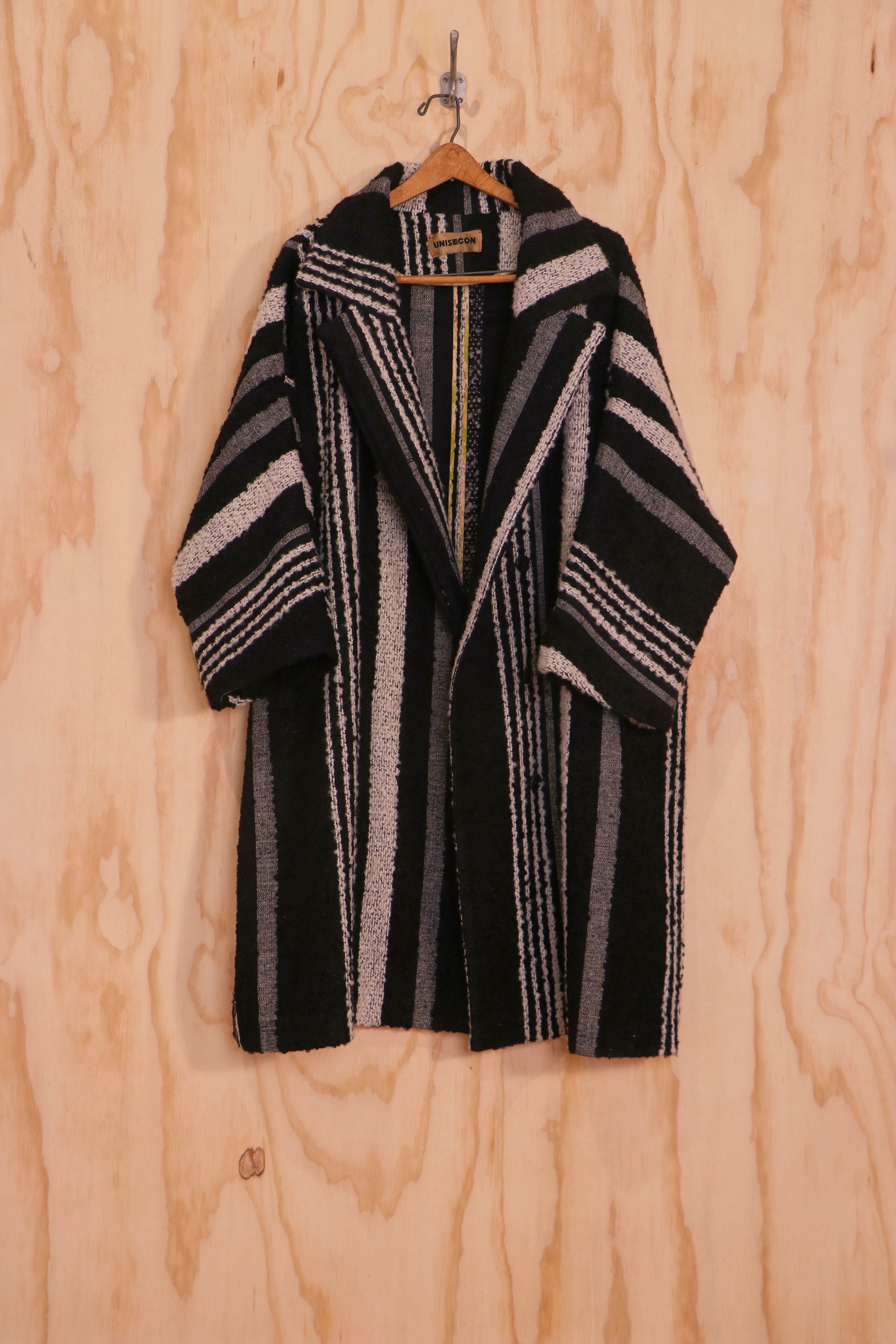 Close-up of convertible stand collar and striped mohair–wool fabric