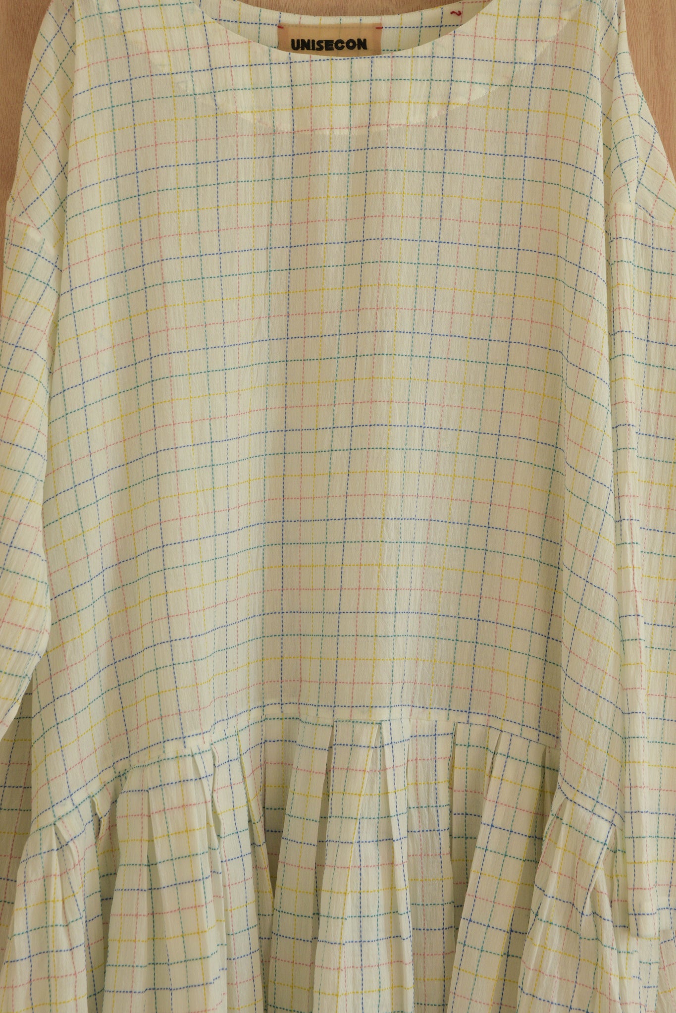 Close-up of embroidery cotton fabric and drop waist seam