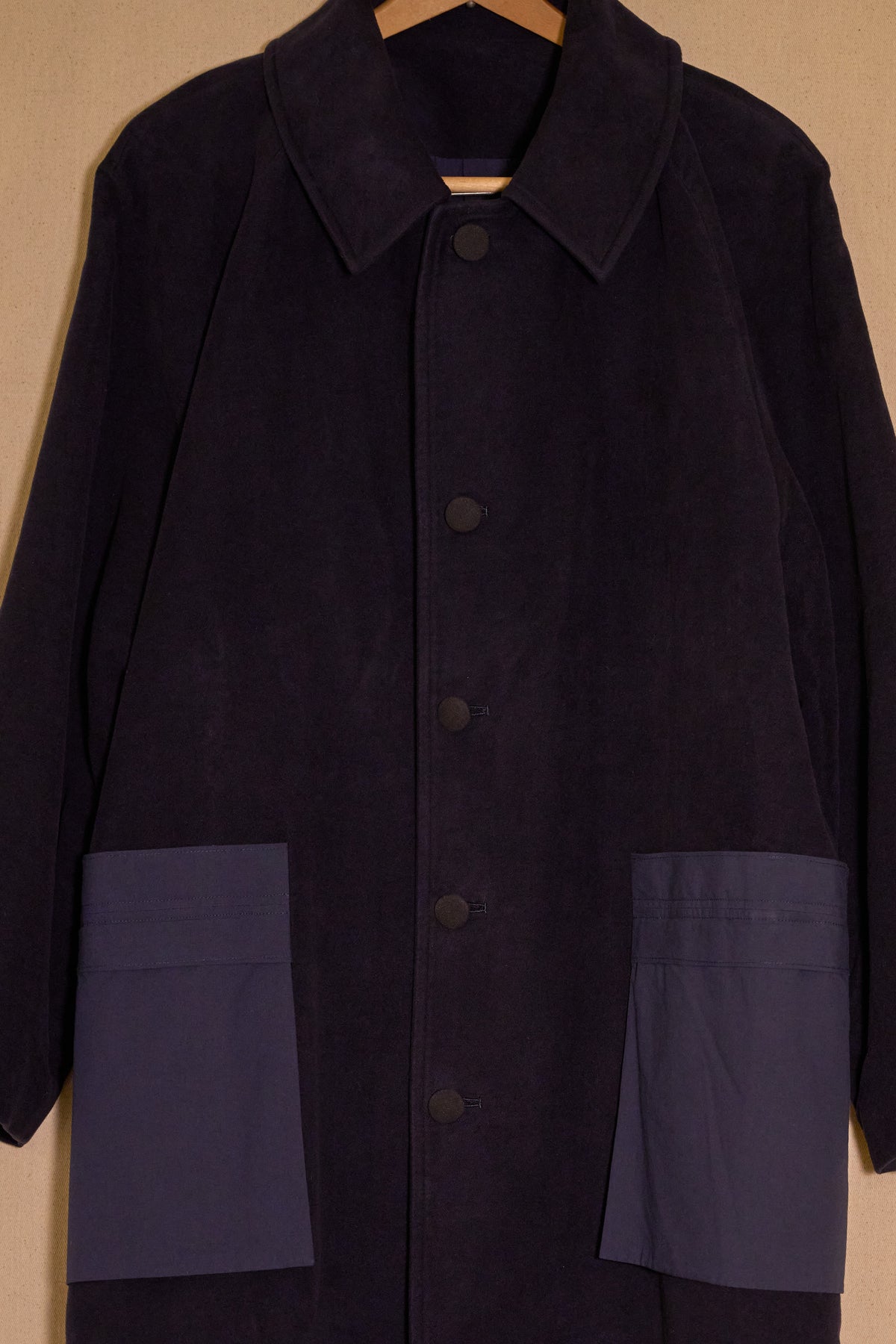 UNISECON Alma coat in blue detail view