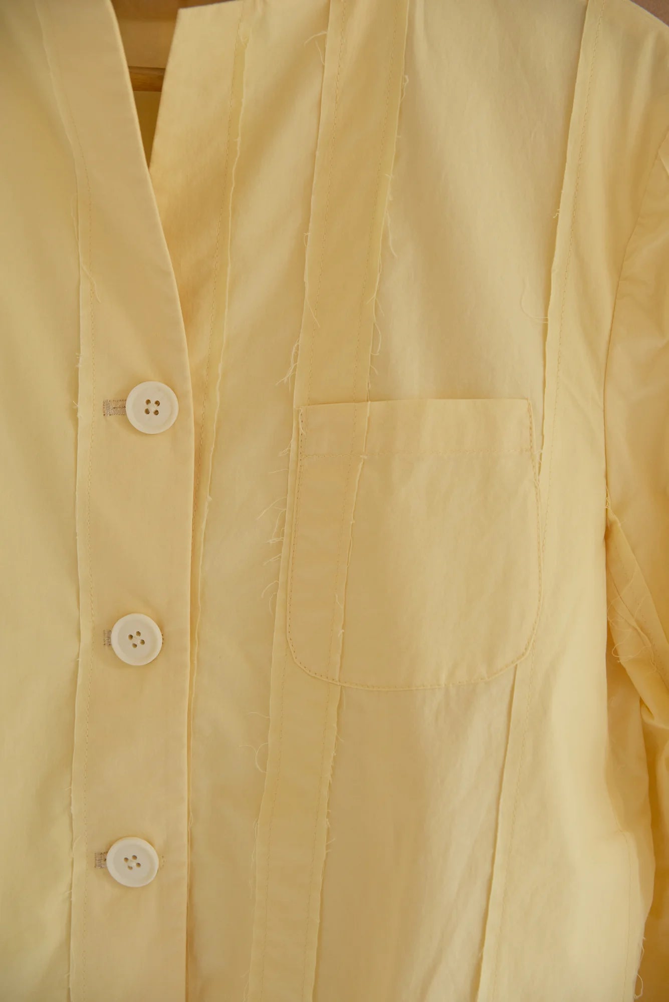 UNISECON Patcha jacket in yellow, detail view
