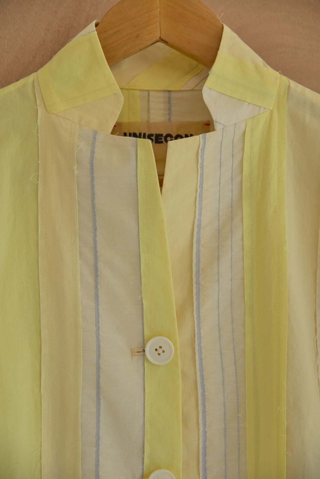 UNISECON Patcha jacket in yellow, detail view