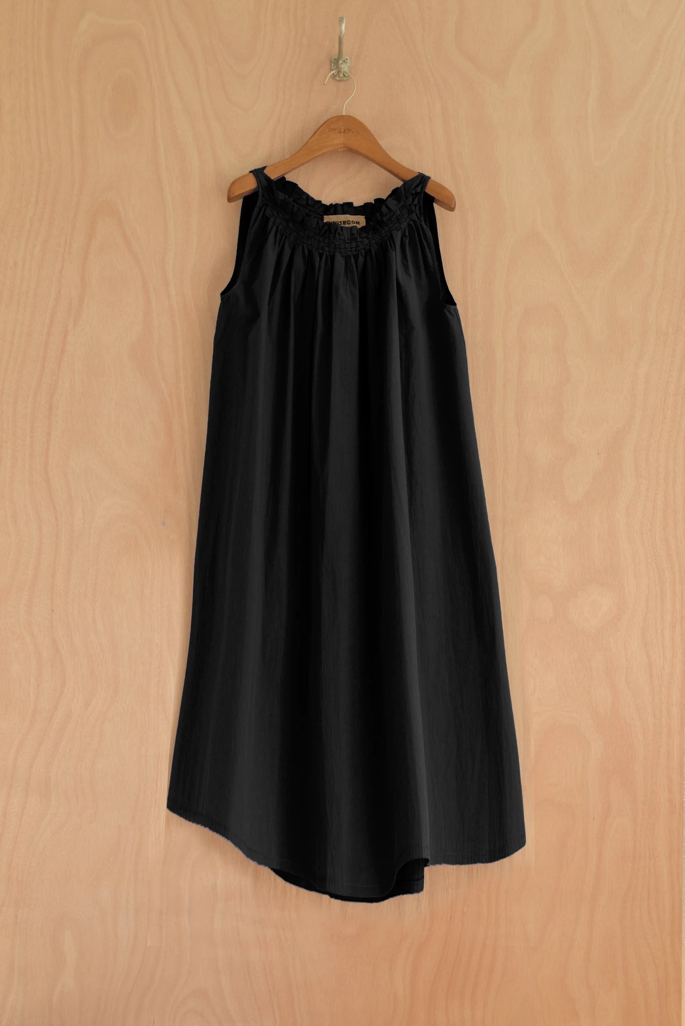 Front view of Zoha Dress in black organic cotton with gathered neckline